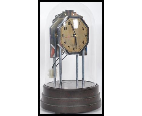 An early 20th century French electric Bulle glass domed anniversary mantle clock having an Art Deco octagonal face with champ