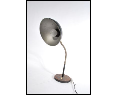 A vintage 20th retro industrial goose neck lamp raised on a circular base with black pendant shade. Measures 55 cm high. Toge