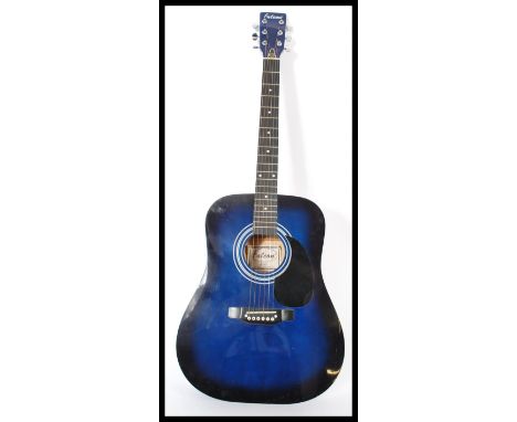 A vintage six string acoustic guitar by Falcon model no FG100BL finished in a vibrant blue colour with black scratch guard an