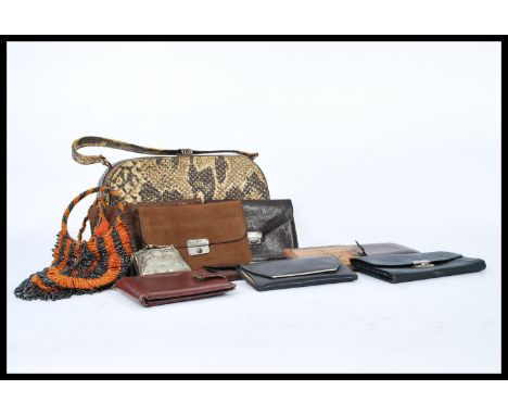 A collection of ladies vintage purses dating from the first half of the 20th Century to include beaded, metal, leather togeth