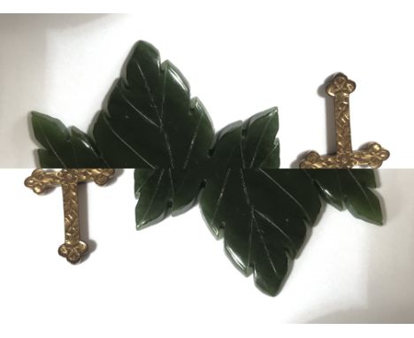 A hallmarked Victorian 9ct gold crucifix together with two 9ct gold necklace chains with another vintage green Jade maple lea