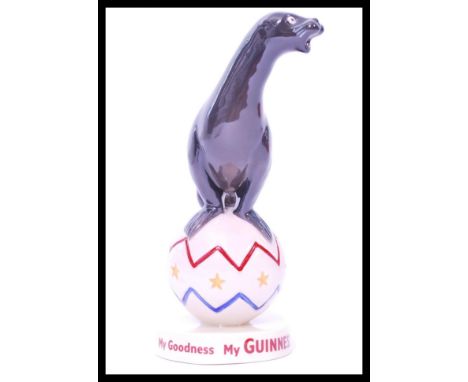 A Coalport ceramic Guinness advertising figurine Sealion. Limited Edition 17/2000. Complete in original box with certificate.