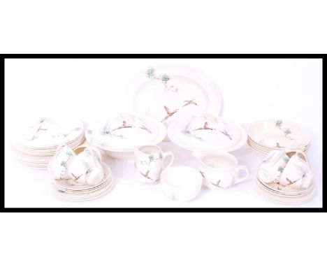 A Royal Doulton ceramic dinner service in the Coppice pattern consisting of plates, tureens etc. Please see images.