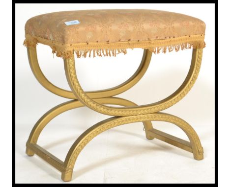 A vintage retro 20th century Lloyd Loom wicker and gilt stool raised on a X base with tapestry seat. Please see images.&nbsp;