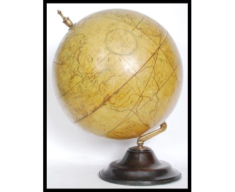 A vintage style 20th century large desk top globe in the antique style raised on a heavy wooden base. Marked Globo Tereste in