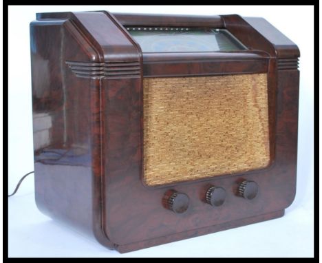 A vintage retro 20th century GEC bakelite radio having a grille front with glass panel dial. AC All Wave 5 Receiver. Measures