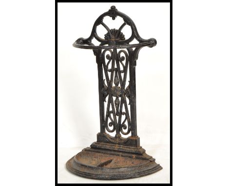 A vintage 20th century Victorian Coalbrookdale style cast metal stick stand having an ebonised finish with half mood tray.