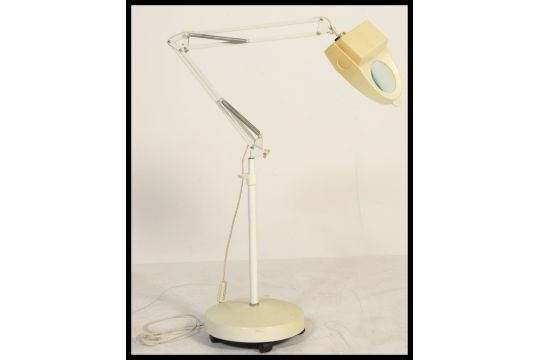 anglepoise lamp with magnifying glass