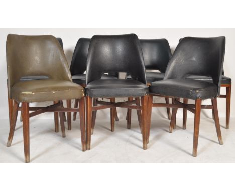 A set of seven vintage retro 20th century chairs raised on tapering supports with vinyl leatherette seats and back rests. Ple