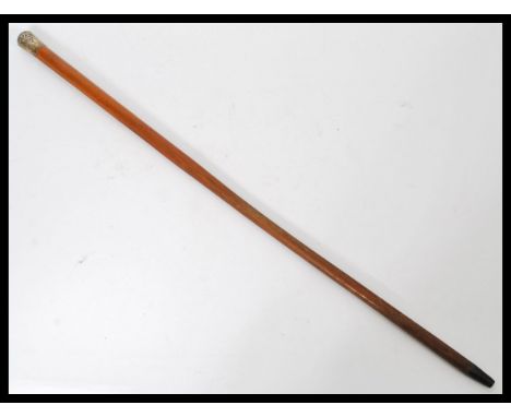 A period silver hallmarked walking stick cane having a tapering Malacca wood shaft with silver hallmarked knob to top.&nbsp;