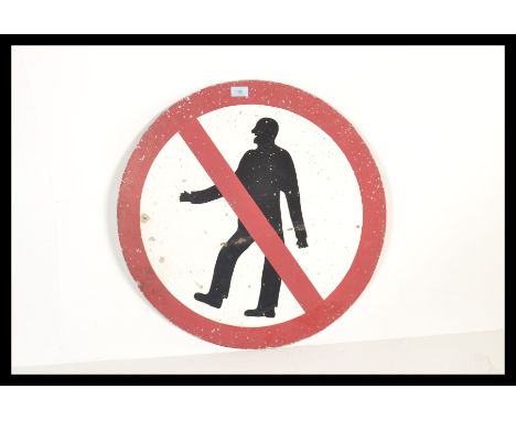 A vintage retro 20th century Worboy's style enamel no pedestrian road sign featuring a person with red circle and line throug