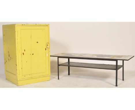 A vintage retro 20th century low coffee table with retro print top along with a yellow painted Air Ministry cupboards. Please