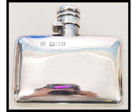 A 19th century Victorian silver hallmarked hip flask by Sampson and Morgan hallmarked for London 1898. The flask of curved re