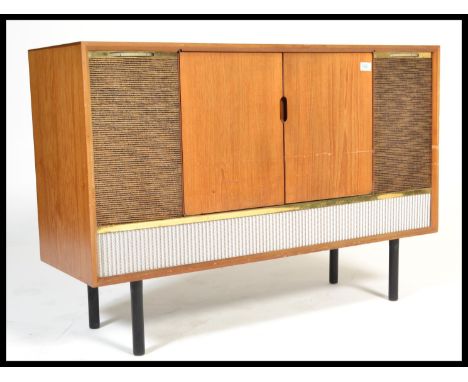 A vintage retro 20th century teak radiogram raised on ebonised supports with grille front. Twin doors opening to reveal a Gar