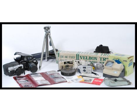A collection of vintage cameras and tripods to include a 35mm Japanese camera Cosina CT1 Super with a Sicor Skylight lens, Ol