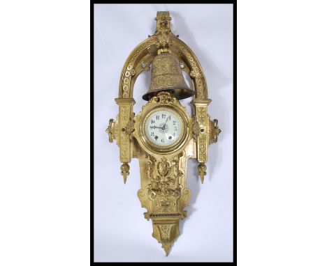 An exceptional 19th century large Cartel French bell clock. Of large heavy gilded brass with decorative scroll work and embel