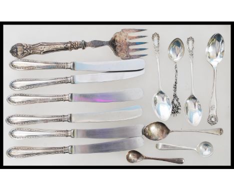 A group of silver hallmarked and silver handled flatware / cutlery to include a set of six knives, toasting fork, teaspoons a