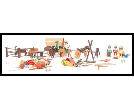 An assorted collection of original vintage Geobra Playmobil to include a western covered wagon with horse and mini figures We