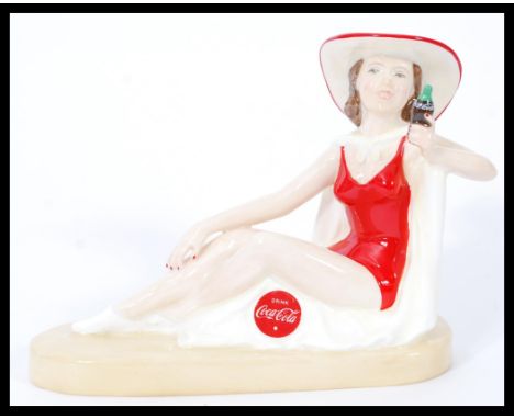 A Royal Doulton Advertising ceramic figurine Coca-Cola Sunbather MCL16. Limited edition 24/750. Complete in original box with