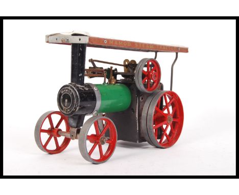 An original vintage Mamod made live steam TE1a traction engine. The engine being modified with reversing lever. Measures; 27c