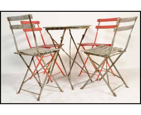 A set of vintage 20th century folding garden table and four chairs having slatted seats and back rests.&nbsp;Measures: 71cm h