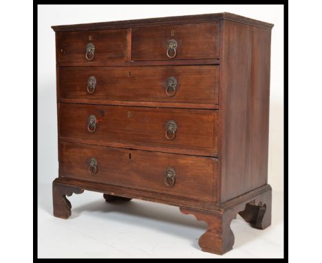 A 19th century Georgian mahogany two over three chest of drawers. The bank of drawers raised on bracket feet with brass lion 