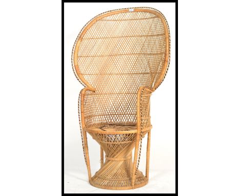 A good 20th century vintage / retro wicker peacock armchair -chair. Large open back chair with woven seat. Measures 135cm hig