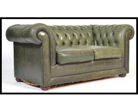 A good 20th century two setter&nbsp;leather button back Chesterfield sofa settee. Raised on bun feet with green leather frame