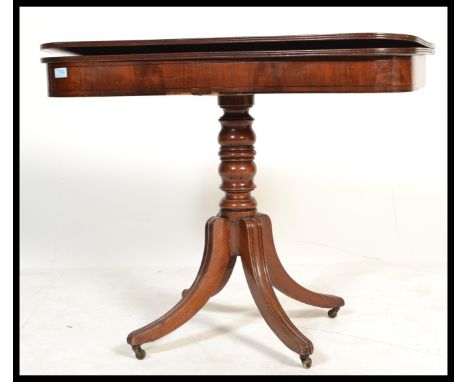 An 18th / 19th century George III mahogany and line ebony inlaid tea table / games card table. Raised on reeded splayed legs 