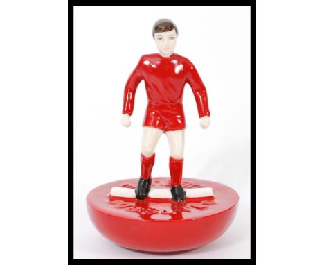 A Royal Doulton Subbuteo ceramic football figurine MCL 12 featuring a player in red kit on red base. Limited edition 195/500.