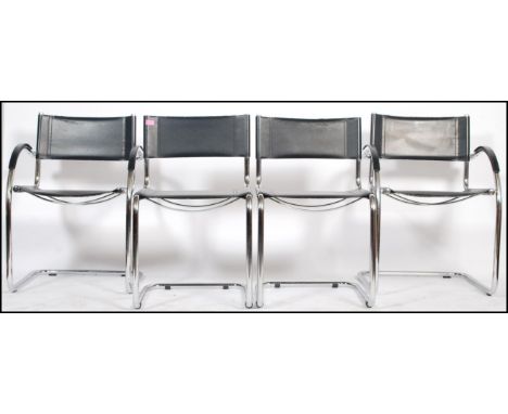A set of four stacking 20th Century vintage Italian tubular chrome cantilever chairs. Two having armrests and the others with