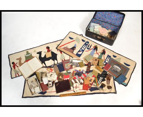 A interesting suitcase of vintage ephemera dating from the early 20th Century to include photo's, driving licences, playing c