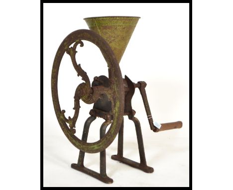 A 19th century Victorian cast iron larger Grocers shop display coffee grinder. Raised on twin stands with large wheel turner 