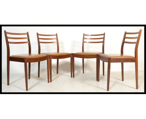 A set of four vintage retro 20th century G-Plan Fresco range dining chairs having ladder back rests with tan leather seats. M