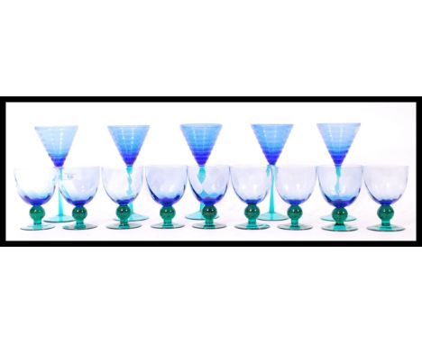 A group of vintage retro 20th century studio art glass goblets and glasses having blue bowls raised on coloured stems. Please