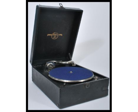 A vintage early 20th century portable picnic gramophone by Columbia, front winder , carry handle to the side with a black vin