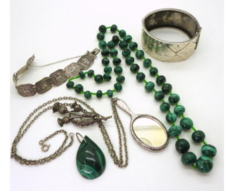 A string of malachite beads, a wide silver engraved bangle hallmarked Birmingham 1883, a silver mounted mirror pendant, a sil