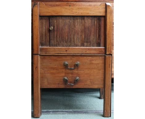 A 19th century mahogany bedside commode with galleried top over tambour door over two faux drawers concealing slide out commo