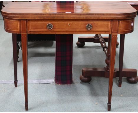 A Victorian walnut and sample wood inlaid fold-over tea table with rectangular top with rounded corners over single drawer on