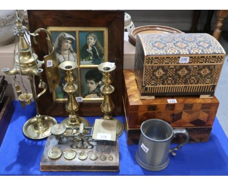 A brass Florentine oil lamp with reflector, a pair of brass candlesticks, a set of postage scales, a straw work box, other bo