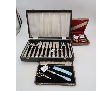 A cased set of silver handled EPNS bladed fish knives and forks, in the Kings pattern, a cased silver and guilloche enamel ma