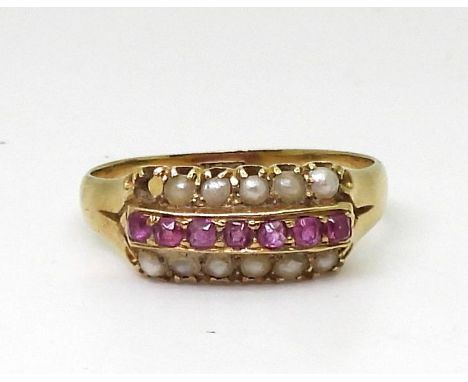 A 15c ruby and split pearl ring, size O1/2, weight 2.7gms Condition Report:One pearl missing.