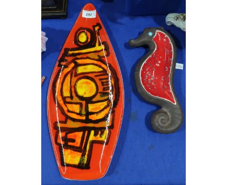 A Poole pottery spear shaped dish, shape number 82, together with a Beswick seahorse shaped dish Condition Report:Available u