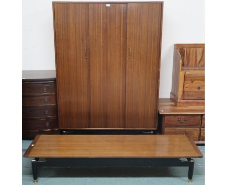 A mid 20th century G Plan E.Gomme wardrobe, 171cm high x 122cm wide x 55cm deep and a G Plan E.Gomme coffee table, 30cm high 