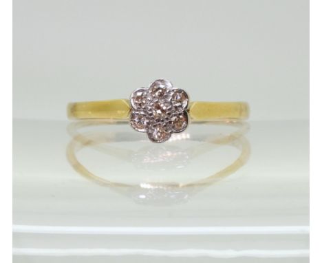 An 18ct gold diamond flower ring set with estimated approx 0.15cts of eight cut diamonds, finger size T1/2, weight 2gms Condi