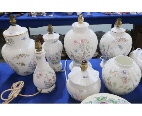 A collection of Aynsley table lamps, mainly in Wild Tudor pattern, a Sweet Pea lamp and a Wedgwood Rosehip jar Condition Repo