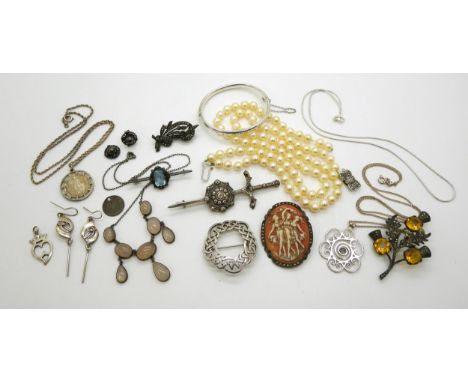 A Robert Allison sword brooch, a John Fraser (Inverness) Luckenbooth brooch, a&nbsp; silver child's bangle, further brooches,