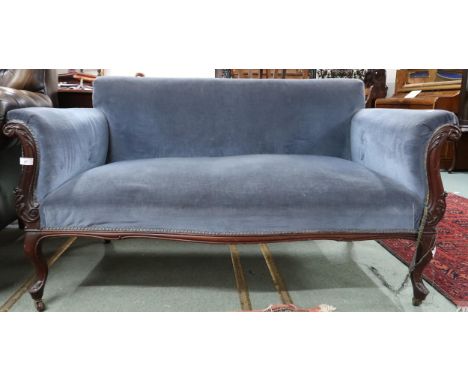 A Victorian blue velour upholstered sofa on carved cabriole supports terminating in ceramic casters, 79cm high x 142cm wide x