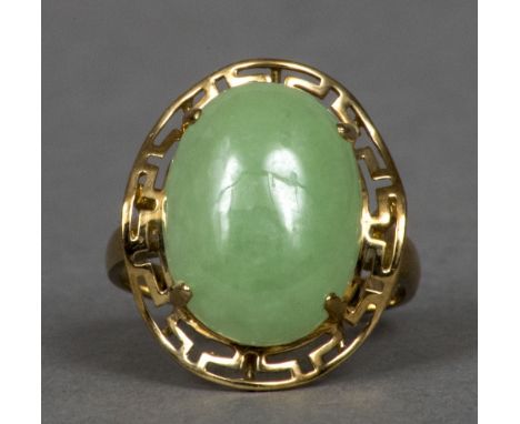 A 9 ct gold jade set ringThe cabochon stone above the pierced shoulder.  1.75 cm wide.    CONDITION REPORTS:  Generally in go