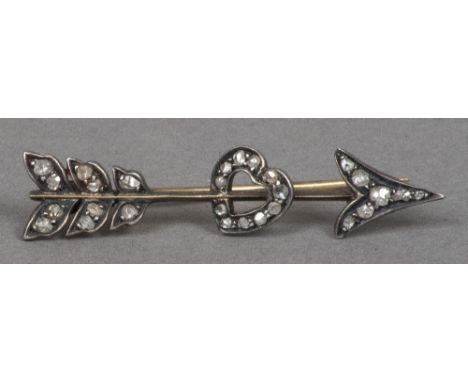 A Victorian diamond set white and yellow metal sweetheart broochFormed as an arrow piercing a heart.  4.5 cm long.    CONDITI